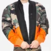 Victor-Aguilar-The-Penguin-2024-Camouflage-with-Orange-Bomber-Jacket